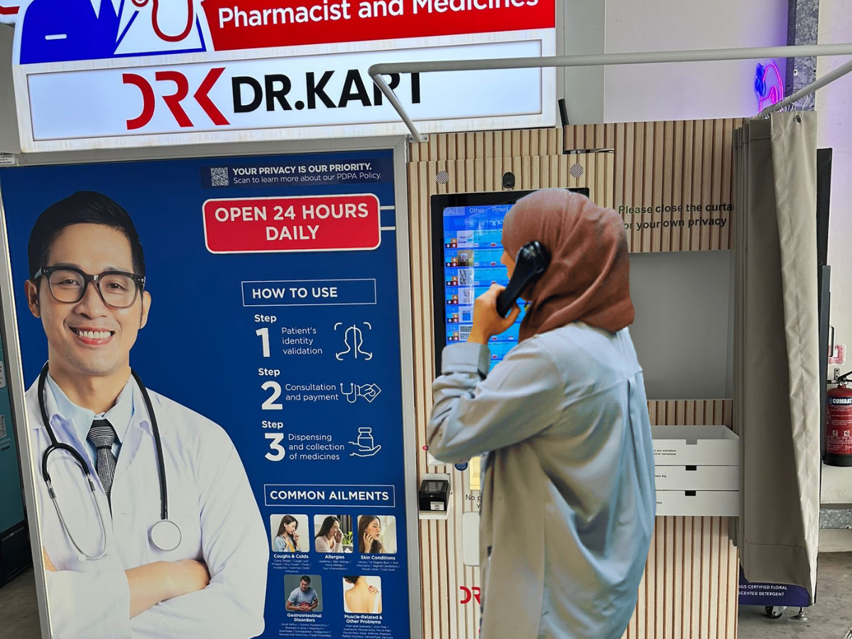 Consult a doctor using the phone at the Dr. Kart vending machine